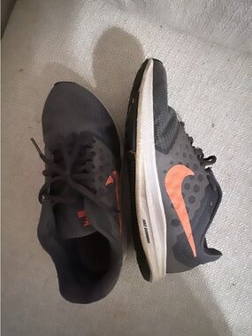 Nike Women’s Charcoal Gray Running Shoes with Orange Swoosh